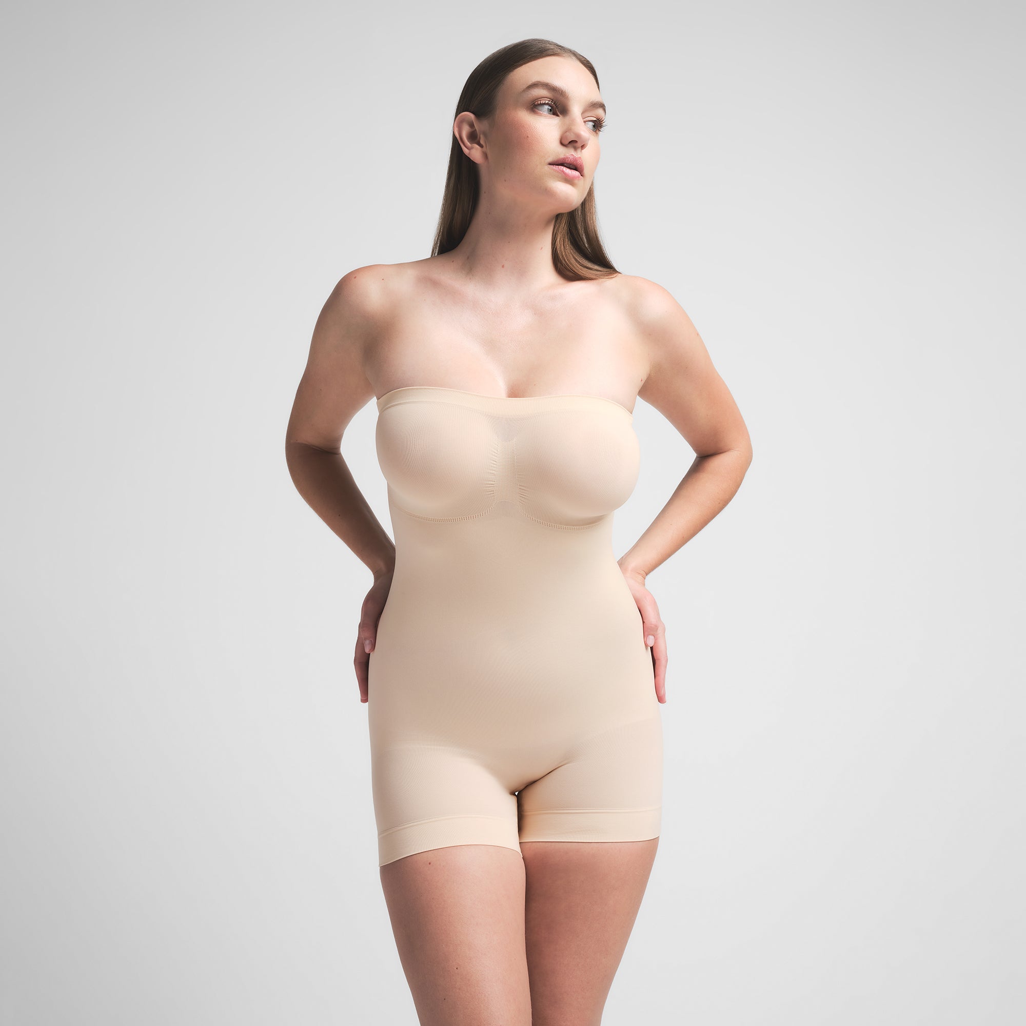 SEAMLESS SCULPT STRAPLESS SHORTIE BODYSUIT | SAND